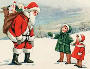 Father Christmas with two small children in the snow