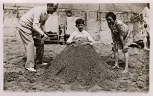 Deckchairs Prints: Father and daughter bury son (brother), British seaside