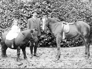 Father and daughter with horse and pony, Mid Wales