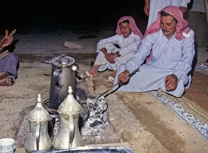 Father and son in Bedouin tent, Syria