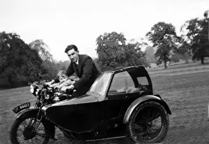 Father & son on a veteran motorcycle