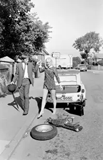 Female contortionist Diana Gaye and car boot