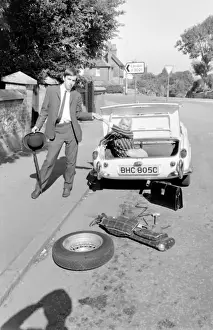 Female contortionist Diana Gaye and car boot