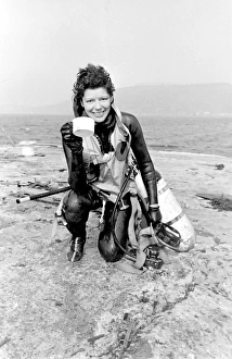 Images Dated 11th September 2015: Female diver returning to dry land