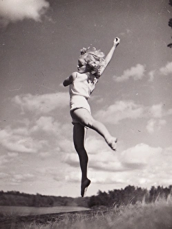 Gymnast Gallery: Female gymnast by lake jump