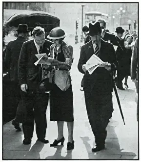 Gender Prints: Female and male warden conferring in street, Sept 1939