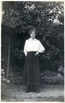 Female student in a suburban garden