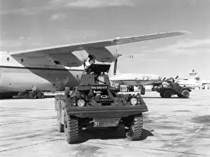 1975 Prints: A Ferret armoured scout car at Belize with a RAF Short SC-5