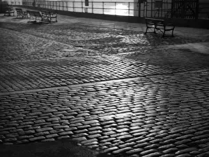 A fine pattern study of granite cobbled stone sets on an unspecified British sea front
