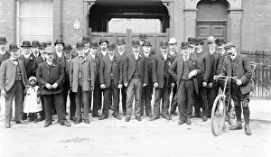 Readiness Prints: Finishers in front of hat factory