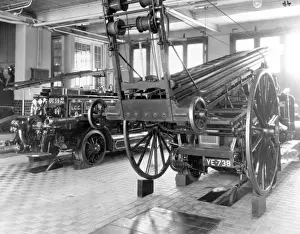 Motorised Prints: Fire appliances in a London fire station appliance room