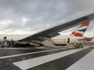 Fire crews attend the aftermath of a plane crash