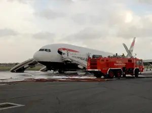 Fire crews attend the aftermath of a plane crash