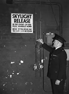 Prevention Prints: Fire prevention officer checking skylight release