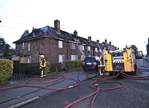 London Fire Brigade Prints: Firefighers at the scene of a house fire, SE London