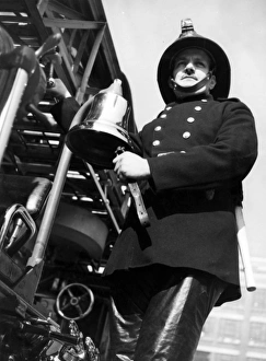 Adjusting Gallery: Firefighter adjusting turntable ladder mechanism