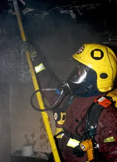 2005 Prints: Firefighter in breathing apparatus working at fire