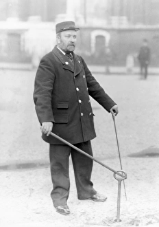 Images Dated 9th November 2011: A firefighter demonstrating the use of a water main key