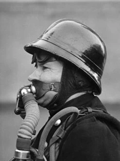Firefighter in new breathing apparatus helmet