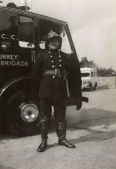Images Dated 9th January 2018: Firefighter posing proudly by LCC LFB vehicle