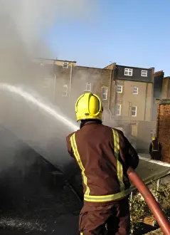 2005 Prints: Firefighter working at scene of fire at New Cross