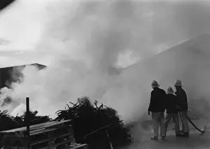 Crediton Prints: Firefighters in action at a farm near Crediton, Devon