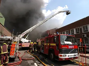 Firefighters in action at a fire, VDC House, Wembley