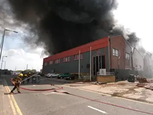 Firefighters in action at a fire, VDC House, Wembley
