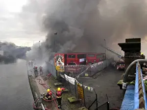 Firefighters attend fire at bus garage