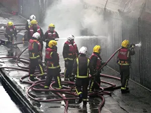 Firefighters attend fire at bus garage