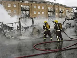 Firefighters attend fire at bus garage
