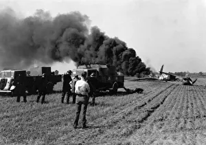 Furrows Prints: Firefighters attending crashed plane in field, WW2