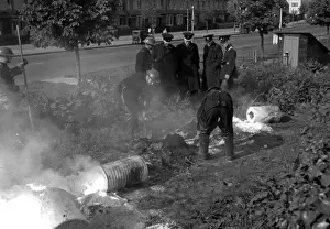 Firefighters deal with small fire caused by explosion, WW2