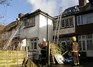 Firefighters dealing with a house fire