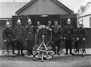 Firefighters with hose and pump equipment