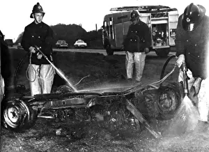Chassis Prints: Firefighters hosing down a burnt-out car