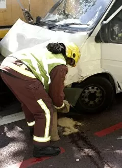 Firefighters inspecting a broken down Ford transit van