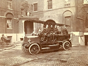 Images Dated 9th November 2011: Firefighters in a pump ladder vehicle
