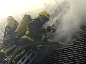 Firefighters respond to a house fire, North London