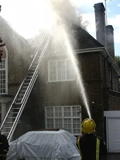 Firefighters respond to a house fire, North London