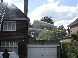 Firefighters respond to a house fire, North London