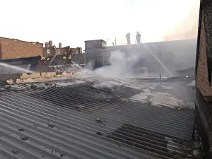 Firefighters at scene of commercial premises fire