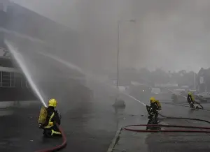 Firefighters at scene of commercial premises fire