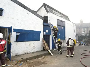 Firefighters at scene of commercial premises fire