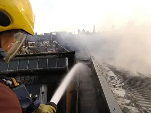 Firefighters at scene of commercial premises fire