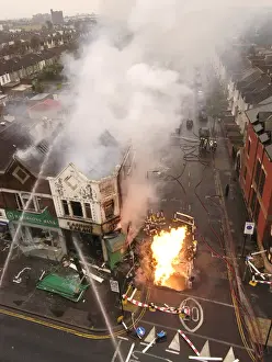 Firefighters at the scene of an explosion