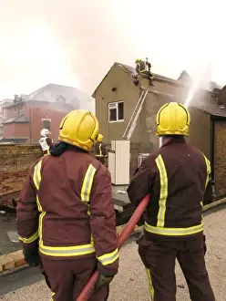 Firefighters at the scene of an explosion