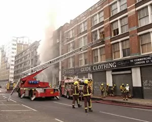 Roadway Collection: Firefighters at scene of fire in Commercial Road