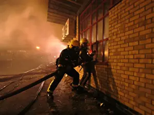Firefighters at scene of fire, Langley Park School