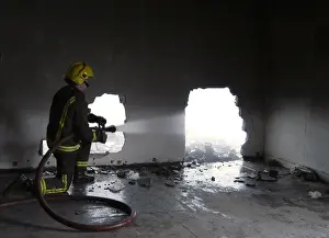 2005 Prints: Firefighters at the scene of a fire in Ruskin Road